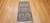 Vintage Persian Nain rug with cream medallion, blue floral motifs, and silk highlights, SKU 1752, 2’ 2” x 4’ 3”, 3rd Quarter of the 1900s