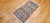 Vintage Persian Nain rug with cream medallion, blue floral motifs, and silk highlights, SKU 1752, 2’ 2” x 4’ 3”, 3rd Quarter of the 1900s
