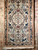 Vintage Persian Nain rug with cream medallion, blue floral motifs, and silk highlights, SKU 1752, 2’ 2” x 4’ 3”, 3rd Quarter of the 1900s