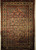 Antique Persian Malayer rug, early 1900s, with geometric design, rust field, French blue spandrels, paisley motifs, and cream border with crab forms.