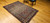 Antique Persian Malayer rug, early 1900s, with geometric design, rust field, French blue spandrels, paisley motifs, and cream border with crab forms.