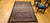 Antique Persian Malayer rug, early 1900s, with geometric design, rust field, French blue spandrels, paisley motifs, and cream border with crab forms.