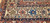 Antique Persian Malayer rug, early 1900s, with geometric design, rust field, French blue spandrels, paisley motifs, and cream border with crab forms.