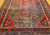 Vintage Persian Hamadan rug in medallion pattern with moss green, red, ivory, and turquoise border featuring geometric and animal motifs.