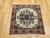 Vintage square Persian Bakhtiari rug with central floral medallion on ivory background in red, blue, green, and brown tones