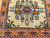 Vintage square Persian Bakhtiari rug with central floral medallion on ivory background in red, blue, green, and brown tones
