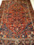 Vintage Persian Heriz Serapi with Abrash French Blue, Yellow, and Red 1822,  7’ 3” x 10’, 4th Quarter of the 1800s, The Persian Knot