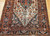 Antique Persian Malayer village rug, late 19th century, pale yellow diamond field with elongated navy medallion and intricate vegetable dye motifs.