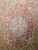 Late 19th Century Antique Persian Kerman Lavar area rug. Hand-woven. 16th-century classic design. Antique red field. Central medallion in French blue and pale pink. Corner spandrels in pale yellow and French blue. Scrolling lines, leaves, and flowers throughout. Pale yellow primary border. Turquoise blue secondary borders. Weaver's signature.