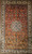 Vintage Turkish Hereke all-silk area rug. Hand-knotted. "Garden Design" with flowers and birds. Copper-red field. Cream central medallion. Ivory border with flowers and birds. Extremely high knot density. Colors: blue, green, yellow, brown, cream. Wall display quality.