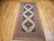Mid-20th Century Vintage Persian Malayer gallery or corridor size rug. Handwoven. Open-field design on camel hair background. Three axial medallions in deep navy with geometric motifs in baby blue, pink, French blue. Cream field with paisley motif. Corner