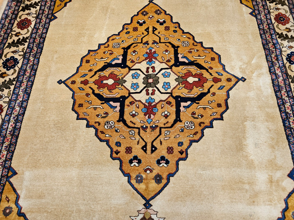 Antique Agra rug from early 1900s India with a yellow medallion, camel field, and Art Deco-inspired botanical motifs, The Persian Knot Gallery, SKU 1619