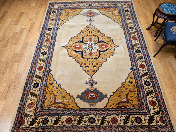 Antique Agra rug from early 1900s India with a yellow medallion, camel field, and Art Deco-inspired botanical motifs, The Persian Knot Gallery, SKU 1619