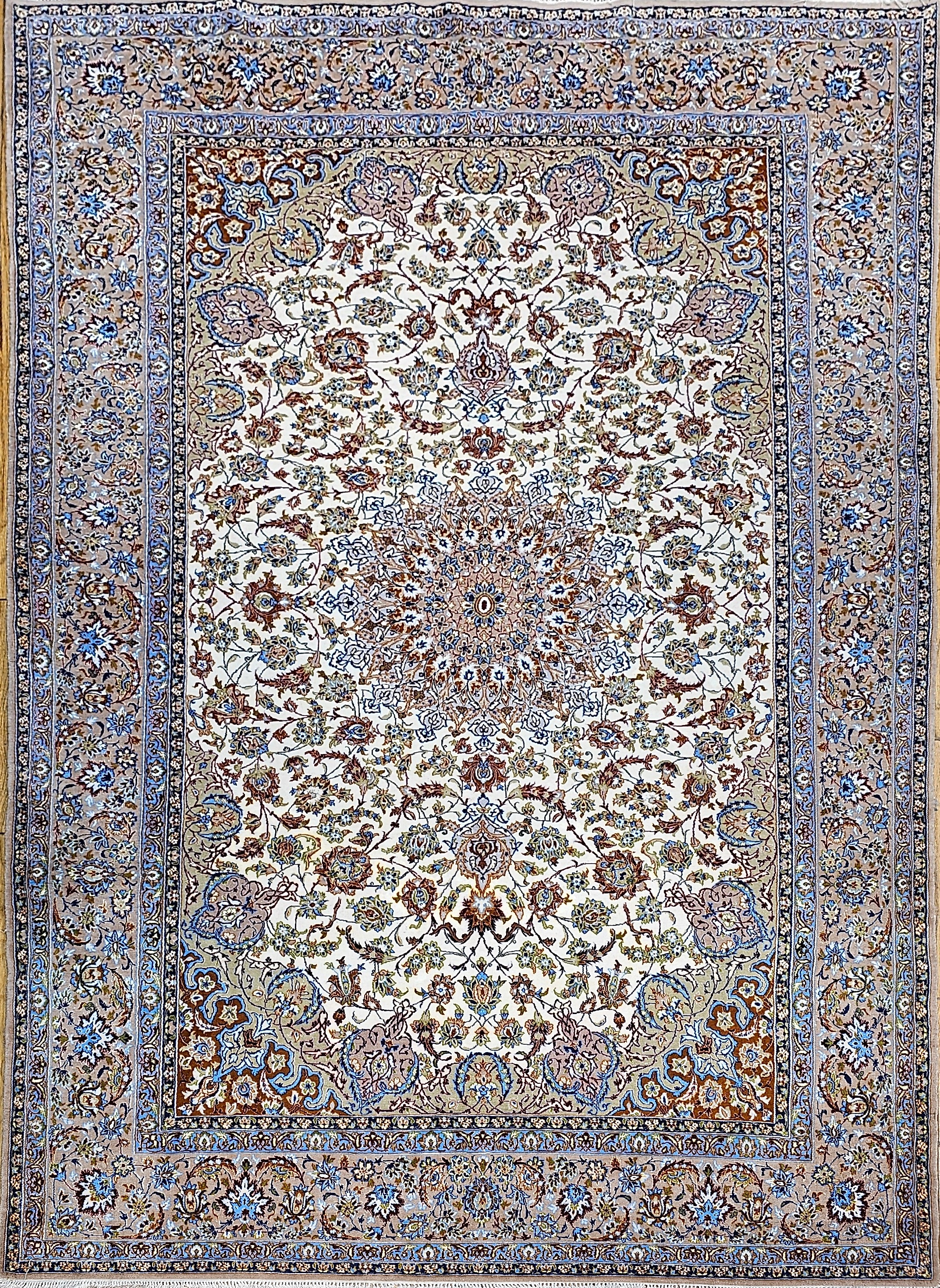 Exceptional vintage Persian Isfahan rug with fine weave, wool pile on silk foundation, and classic Shah Abbas "Leaf and Sickle" floral design in ivory, green, blue, caramel, and brown. Ideal for elegant interiors.