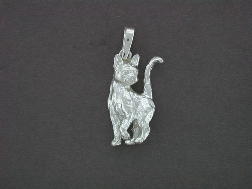 Sterling silver cat with tail up jewelry piece.