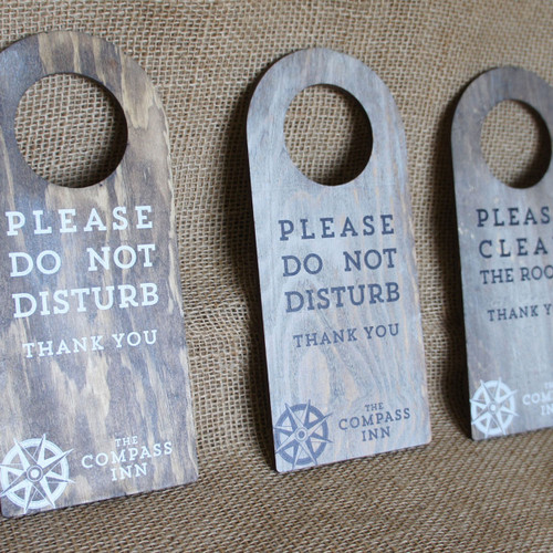 Wooden "Do Not Disturb" Door hanger signs.  Hook fixings.  Sign is light oak stained pine with white wash and printed graphics.  Can be personalised.
