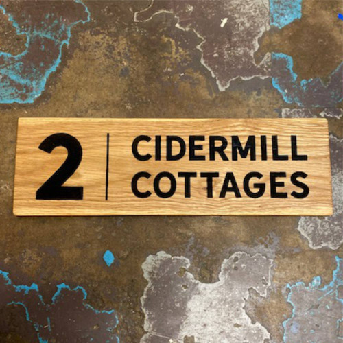 Engraved solid oak house signs.