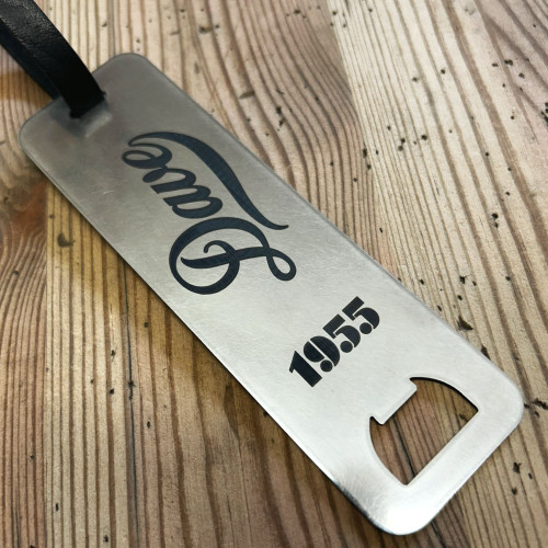 Stainless steel golf bag tag with integrated bottle opener