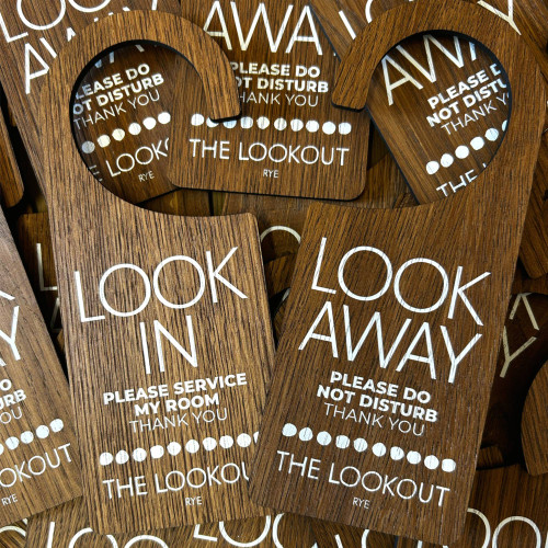 pack of personalised Do Not Disturb wooden door hanger signs for hotel guests

