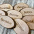 Engraved rustic wood slice badge with pin attachment