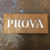 Stainless steel lettering inlaid into solid oak sign.
