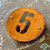 Round rusty steel house names and numbers. Rusty steel signs. Weathered steel signs. Corten steel signs. Corten steel round house number plaques.