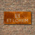 Corten steel sign with stainless steel backing plate on stainless steel stand off fixings
