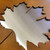 Close up of a mixed steel sign. Laser cut Corten steel with a stainless steel backing sheet.