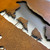 Close up of a mixed steel sign. Laser cut Corten steel with a stainless steel backing sheet.