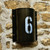 Antique gold with black flecked light surround with personalised number.