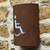 Corten steel curved light with disabled toilet symbol