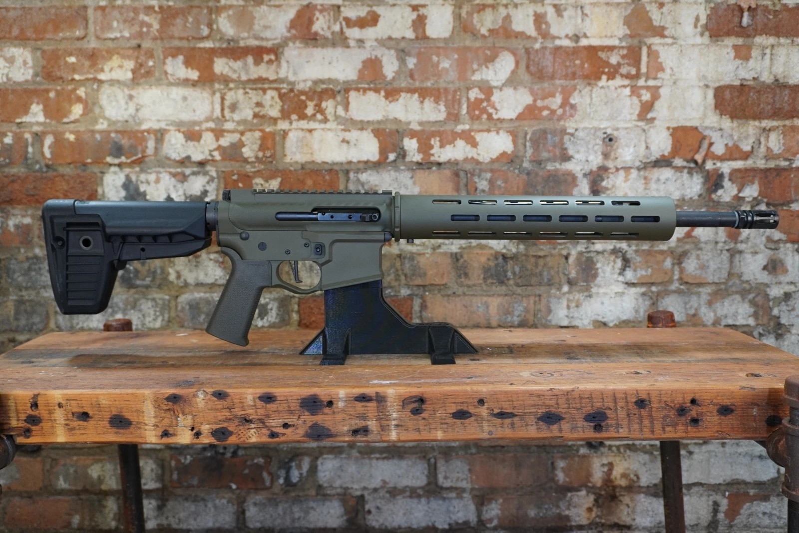 MBZ-15 Multi Cal rifle in OD Green with 16 inch barrel on workbench