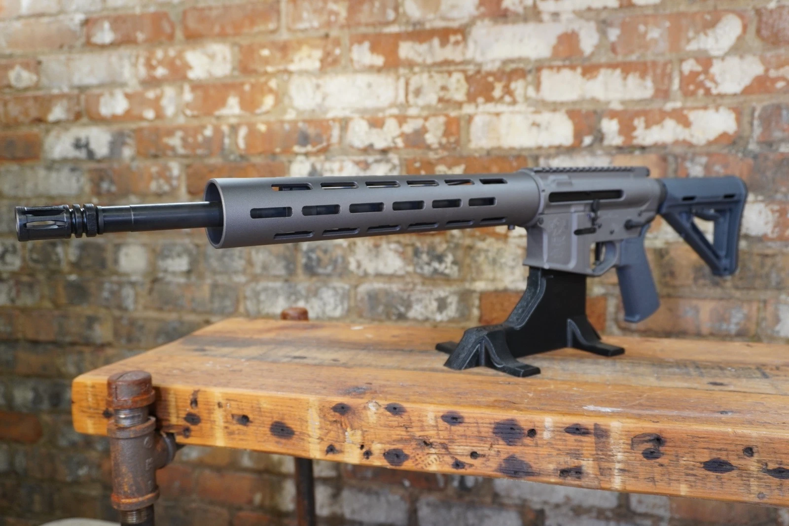 MBZ-15 Multi Cal rifle with free float handguard on bench stand