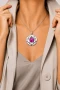 Miglio Fuchsia Camelia Flower Pendant on a model.