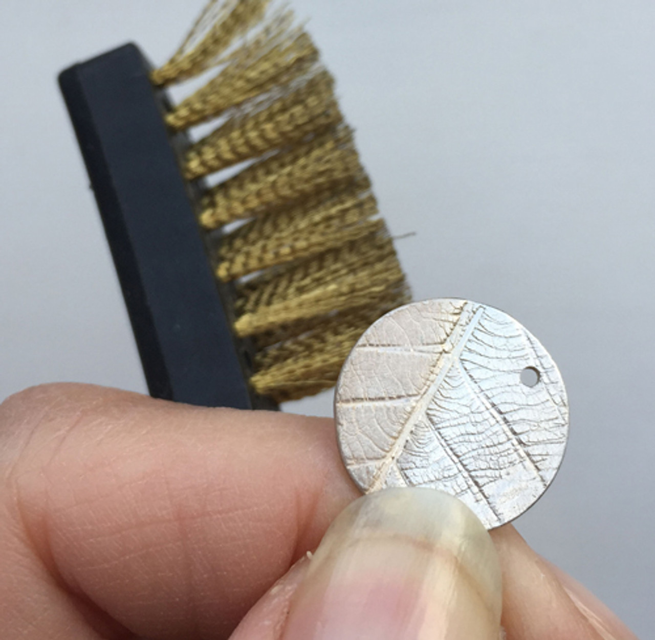 The brass brush in action. 