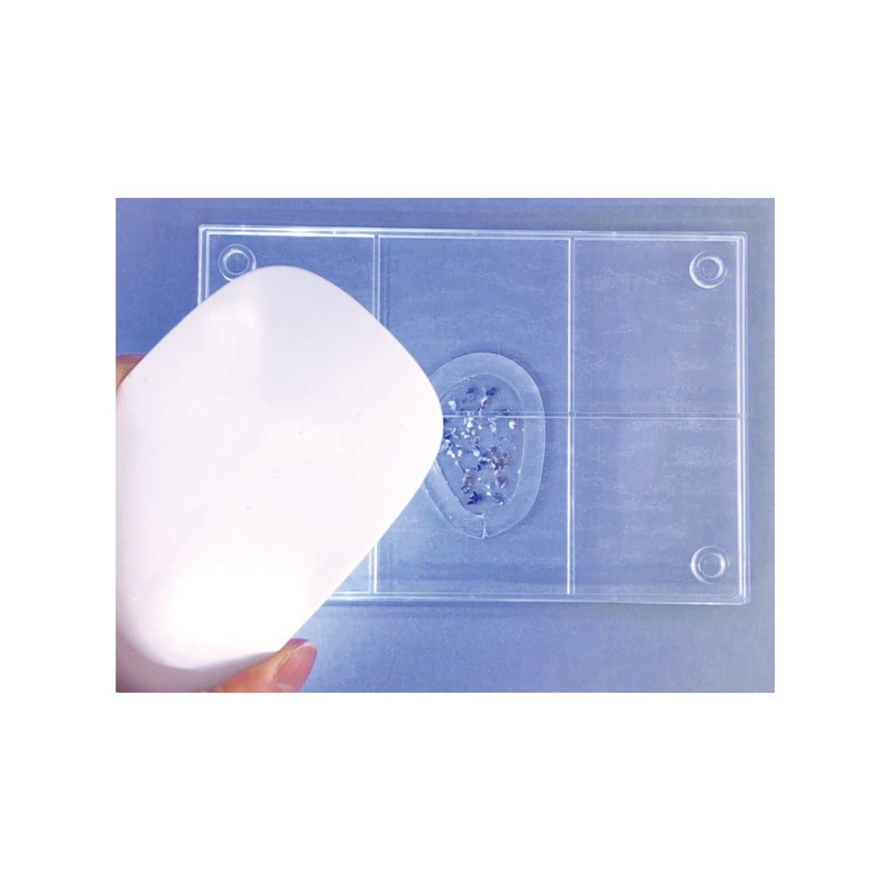 cure the UV resin on or under the clear board