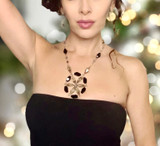 Adjust medallion neckline … stunning necklace that ends w a Crystal bead float down your back. 