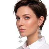 High-definition macro shot of Karen Curtis NYC tiered crystal duster earrings on a sophisticated brunette model in a white button-down.