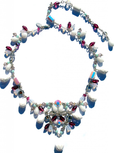 Hand made Swarovski crystal necklace on sterling silver. Titled the chunky v-necklace and made with larger size Swarovski elements. It can adjust to different lengths and incorporates very rare beads that date back to the turn of the century.