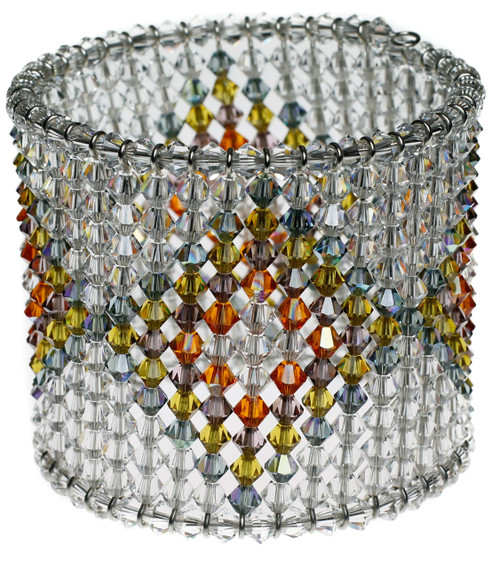 Patterned cuff bracelet with layered diamond pattern in jewel tones.