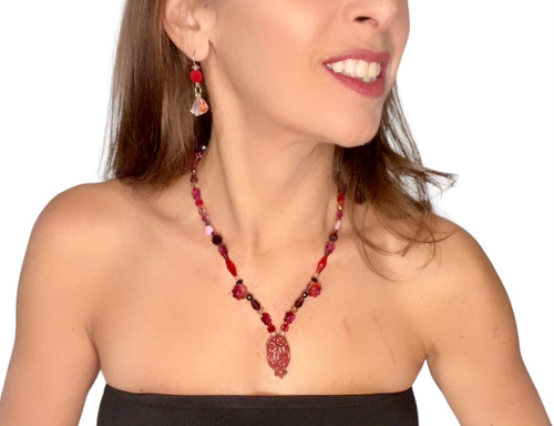 pendant necklace loaded with rare shaped swarovski crystals and a red carnelian bead finished with 14kgf metal by designer karen curtis
