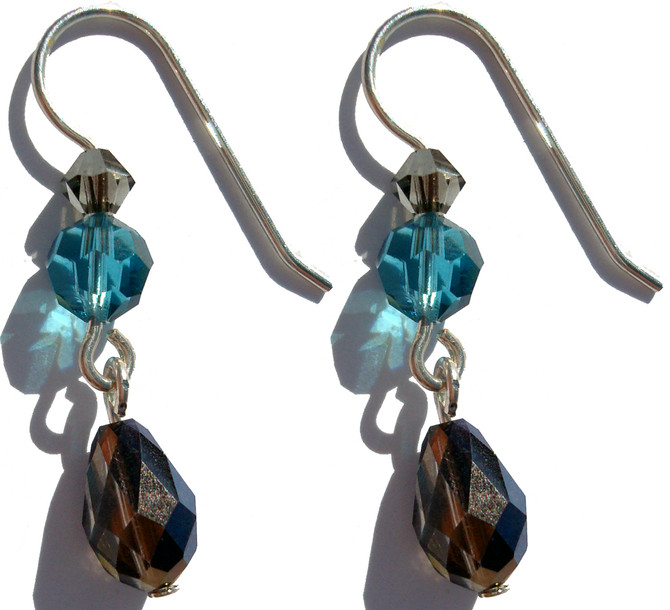 Limited edition designer earrings, handcrafted on sterling silver, exclusively made with Swarovski® crystal


Colors include:  Smokey Topez, bermuda blue and Indicolite.