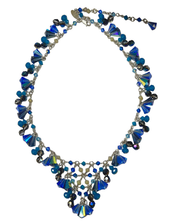 Limited edition statement necklace by designer karen curtis, Her v- necklace is her signature style loaded with different shape of  blue from the swarovski  company  on sterling silver