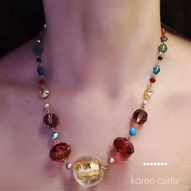 Multicolored, vibrant, chunky statement, necklace, loaded with rare Swarovski crystal includes a center antique venetian bead made in 14 karat gold filled metal by designer karencurtis