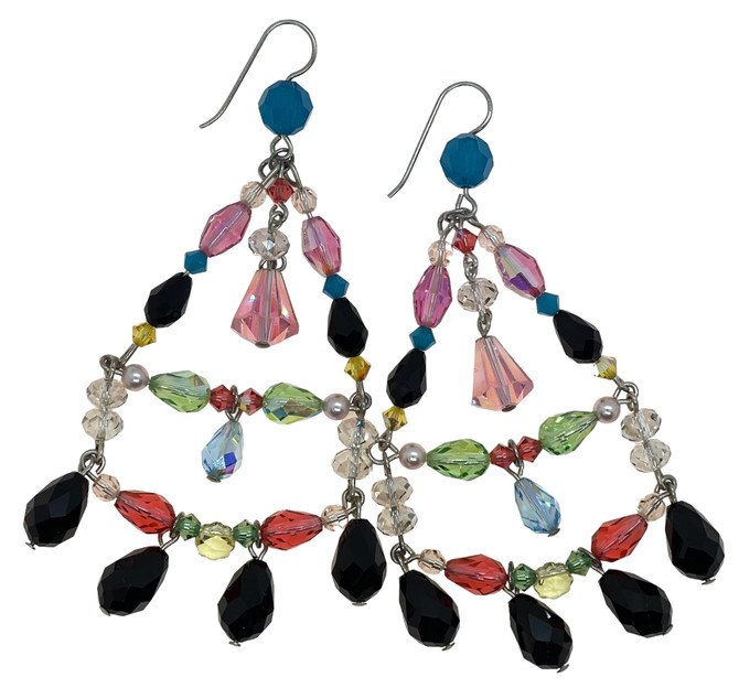 Illuminate your look with our Limited Edition XLG Chandelier Earrings, a dazzling display of rare Swarovski crystals. The vibrant colors and modern design make these earrings a unique and sought-after accessory.