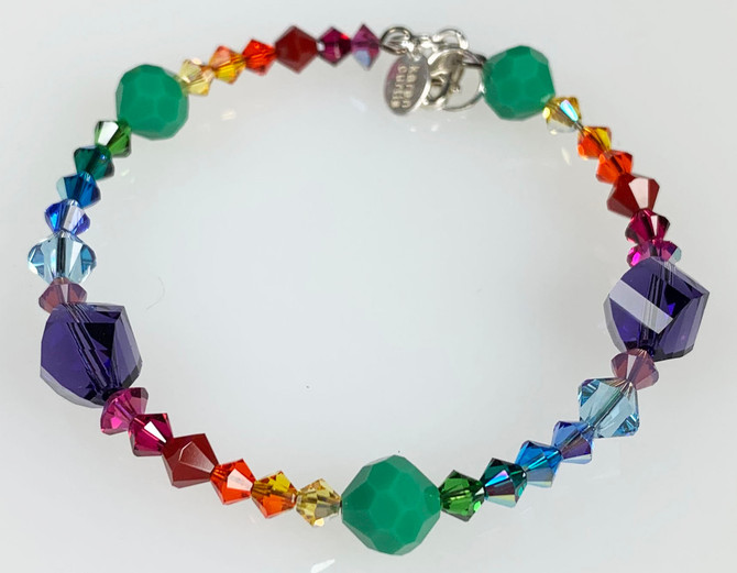 rainbow bangle bracelet designed especially for pride month.  finished with sterling silver. swarovski crystals and include vintage apple green swarovski . limited edition by designer karen curtis