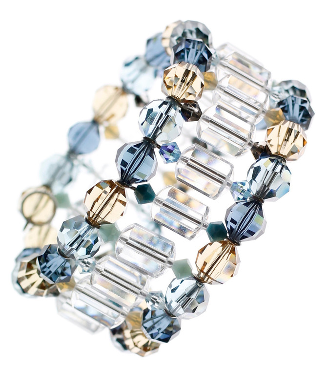 Soft hues of tan and blue with clear crystal create a stunning cuff bracelet