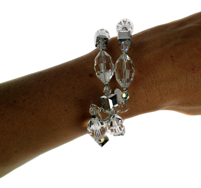 Hand crafted Bangle Bracelet made with Swarovski® Elements.  Limited edition with clear and silver crystals