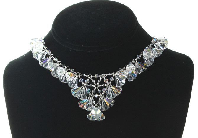 Wear necklace as a collar by clasping at 14-14”. This v necklace is Karen’s signature style. Handmade with crystals from Swarovski . Sterling Silver. Limited Edition made with very rare discontinued Swarovski that date back to the 1930's..