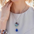 Limited Edition caged pendant necklace hand wire wrapped in sterling silver with nautical colored crystals by Swarovski